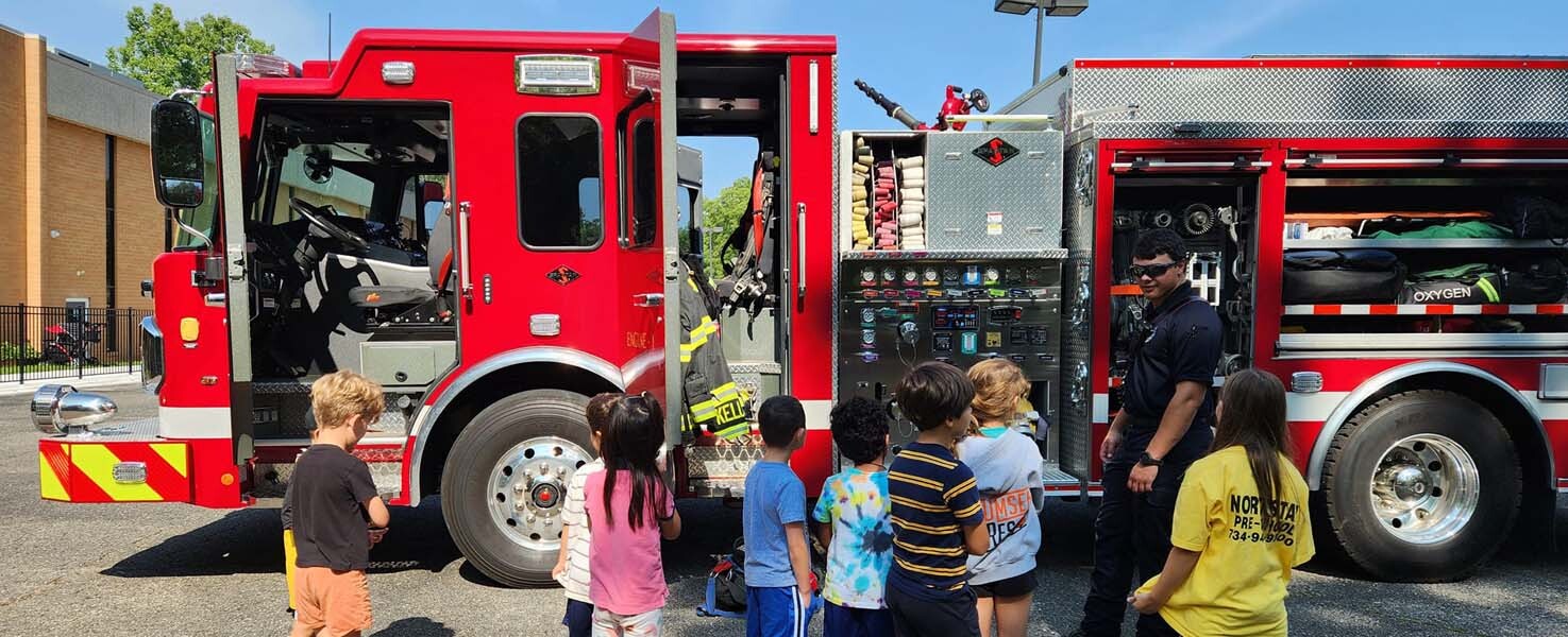 Children learning about a fire truck